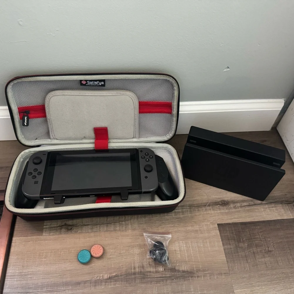 Nintendo Switch with Black and Gray Accessories